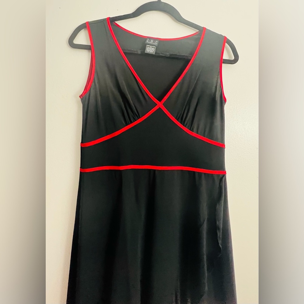 Knit dress. Blk w/ red silk trim in bodice. Bias ruffle from bodice and hem line